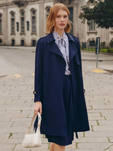 a lady in navy blue triacetate trench coat